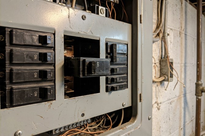 Close-up of a tripped circuit breaker in a residential electrical panel